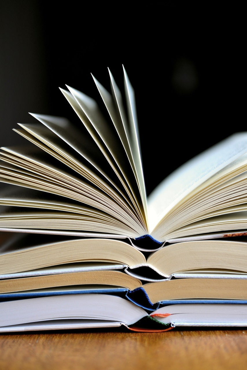 Stacked open books